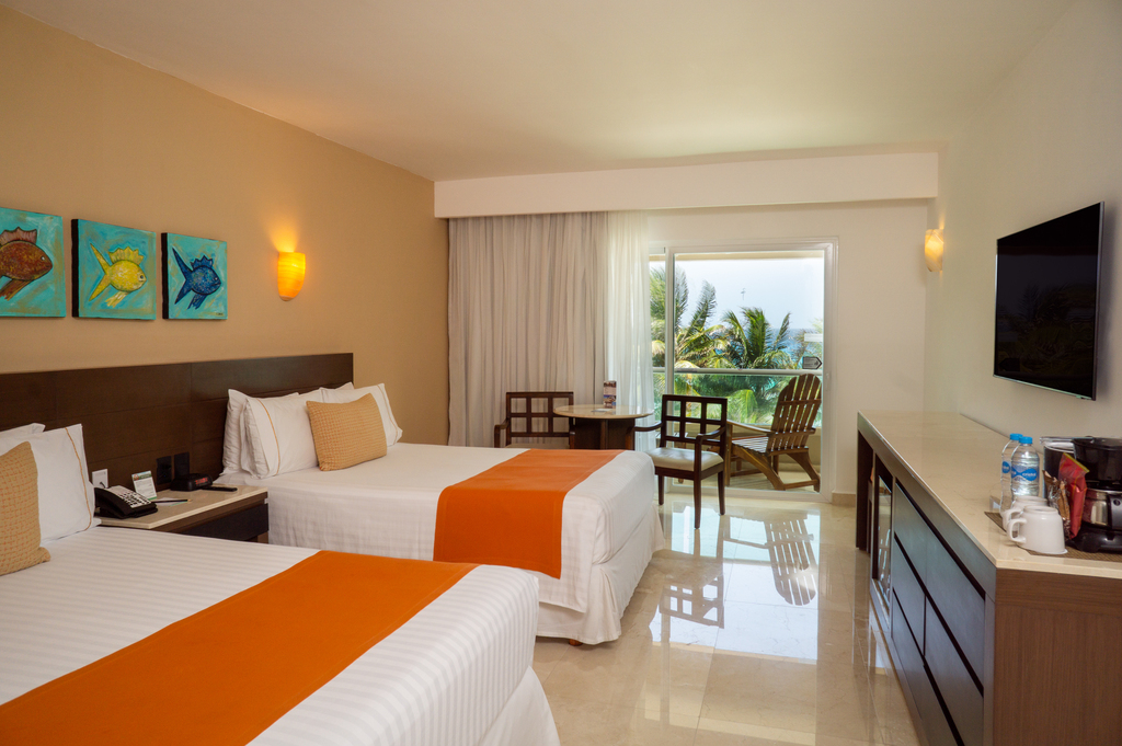 Standard Sea View room at Flamingo Cancun with two beds and a balcony overlooking the sea